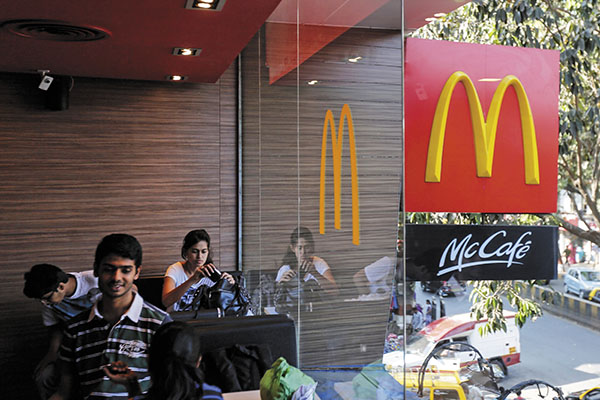 McDonald's tries to keep its head above water with cost cuts