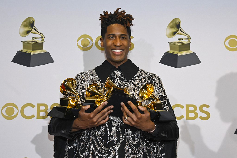 Jon Batiste winner of best American roots performance, best American roots song, best music video and best score soundtrack for visual media poses in the winners photo room during the 64th Annual GRAMMY Awards at MGM Grand Garden Arena on April 03, 2022 in Las Vegas, Nevada. (Credit: David Becker / GETTY IMAGES NORTH AMERICA / Getty Images via AFP)