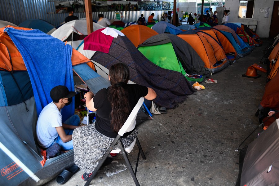 Thousands of Ukrainians have flown to Tijuana to cross the land border to the United States. (Credit: Patrick T. FALLON / AFP)