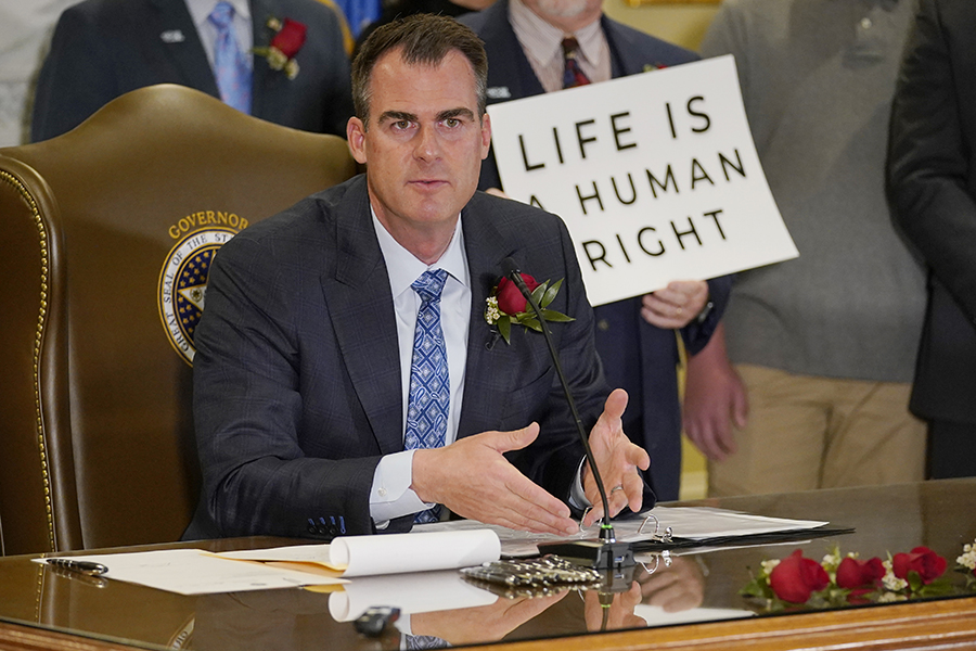 Oklahoma Gov. Kevin Stitt speaks after signing into law a bill making it a felony to perform an abortion, punishable by up to 10 years in prison, Tuesday, April 12, 2022, in Oklahoma City.
Image: AP Photo/Sue Ogrocki