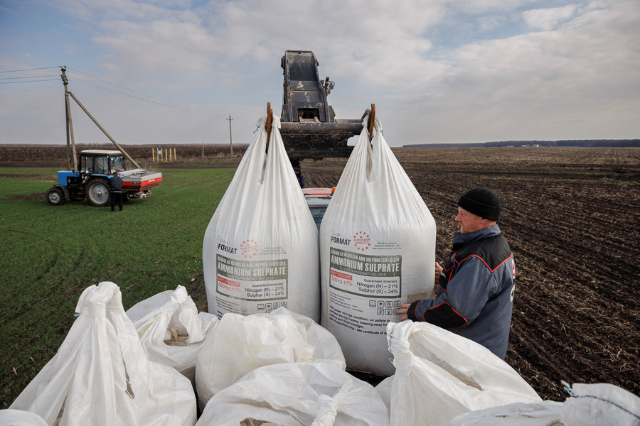 A local farm worker unloads fertiliser from a truck to use on a wheat field near the village of Yakovlivka after it was hit by an aerial bombardment outside Kharkiv, as Russia's attack on Ukraine continues, April 5, 2022. The wheat has been sown for the coming season but nobody in the farming village knows if it will be harvested.
Image: Thomas Peter / Reuters