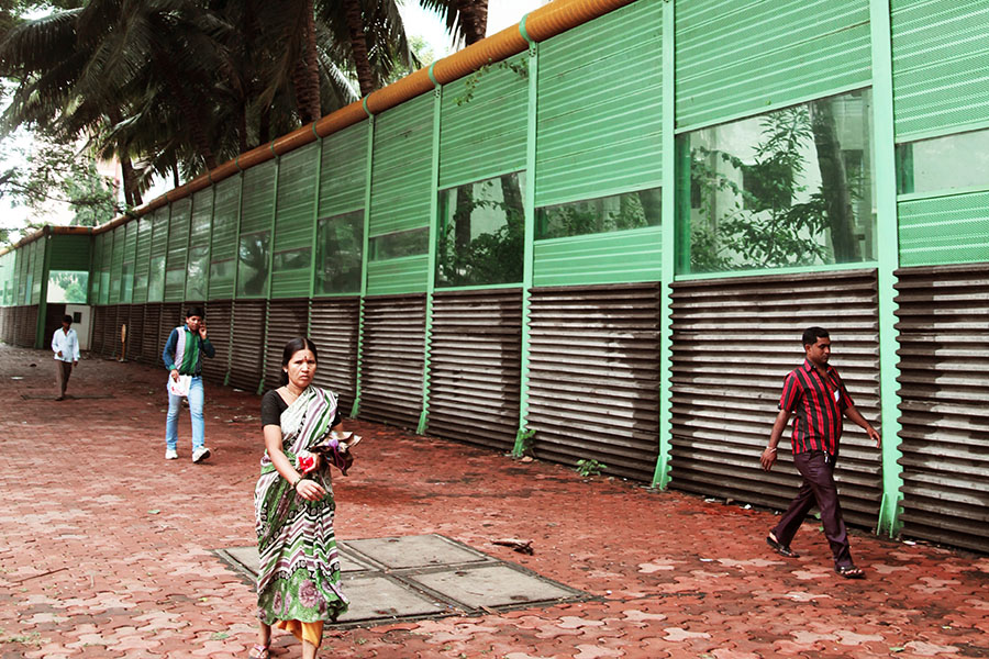 In Mumbai, noise barriers are mandated under the Development Control Rules at all new flyovers, to protect residents from traffic noise. Similar barriers can be used at construction sites too.  However, BMC building permissions are given without mitigation measures even though protecting health and environment are primary responsibilities of Government.
Image: Dhiraj Singh/Bloomberg via Getty Images