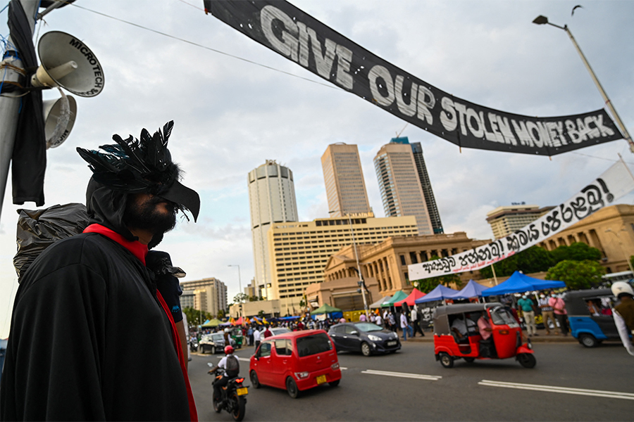 A protestor participates in an ongoing anti-government demonstration outside the President's office in Colombo on April 27,2022, demanding the resignation of President Gotabaya Rajapaksa over the country's crippling economic crisis. (Credit: ISHARA S. KODIKARA / AFP)