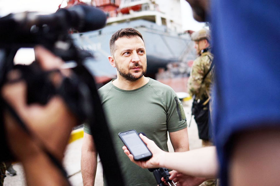 This handout picture taken and released by Ukrainian Presidential Press Service on July 29, 2022 shows the President Volodymyr Zelensky facing journalists during a visit to Black Sea port of Chornomorsk. Ukraine President Volodymyr Zelensky visits the southern port of Chornomorsk ahead of the first anticipated export of grain under a deal with Russia. Image: UKRAINIAN PRESIDENTIAL PRESS SERVICE / AFP

