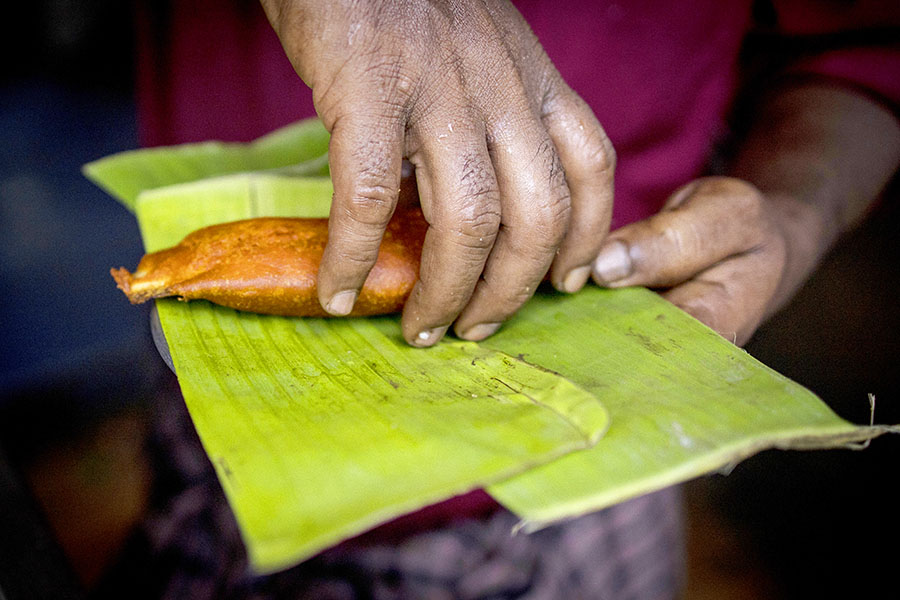 Produce hawker Amul Vasudevan, who was fined repeatedly for using throwaway bags, along a busy road in Chennai, India, July 7, 2022. India’s state of Tamil Nadu was not the country’s first to try to curtail plastic pollution, but unlike others it was relentless in enforcing its law. (Anindito Mukherjee/The New York Times)