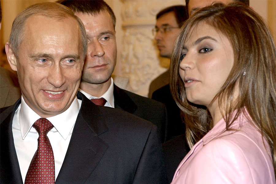Russian President Vladimir Putin (L) smiles next to Russian gymnast Alina Kabaeva during a meeting with the Russian Olympic team at the Kremlin in Moscow, in this November 4, 2004 file photo. Image: Reuters 