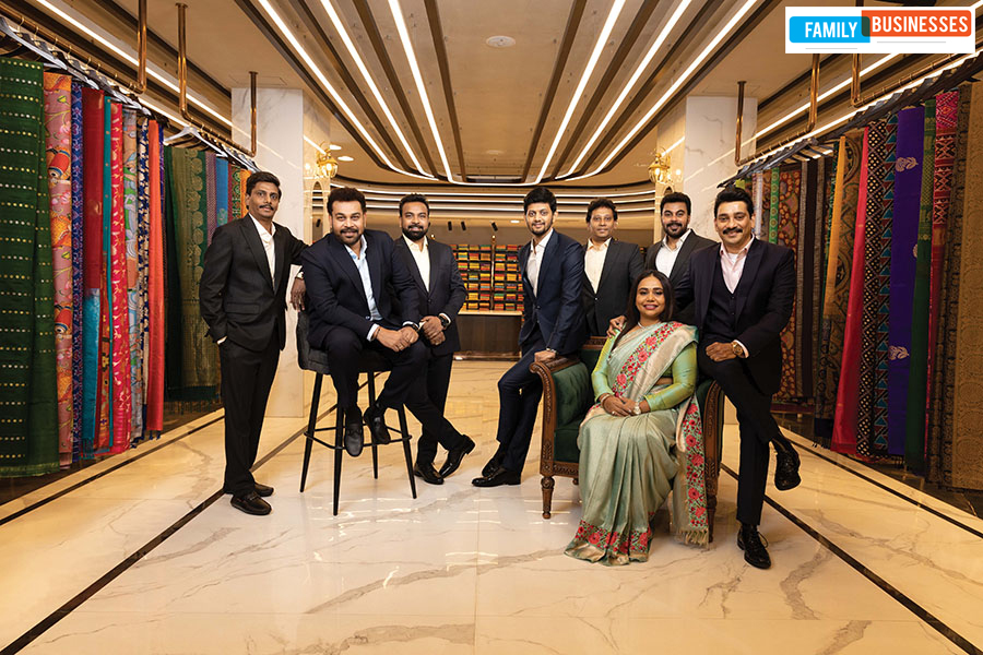 Team Sai Silks (Kalamandir), from left: Durgarao Chalavadi, whole-time director, head operations (Karnataka); Kalyan Srinivasa Annam, whole-time director & head of advertisement projects; Venkata Rajesh Annam, senior VP-operations (Andhra Pradesh); RB Bharadwaj, senior VP-IT & ecommerce; Mohan Chalavadi, senior VP-operations (Telangana); Jhansi Rani (seated), head-retail;  Annam Subash, head of sourcing; Prasad Chalavadi, founder & managing director Image: Vikas Chandra Pureti for Forbes India