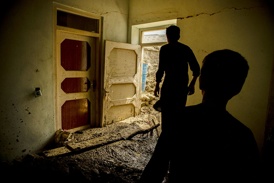 Residents after a flash flood that devastated several villages in Shinwari, eastern Afghanistan, on Aug. 17, 2022. Dilkhah, in her 60, break into tears, describing how she has lost everything she own after flash flood washed away her house. (Kiana Hayeri/The New York Times)