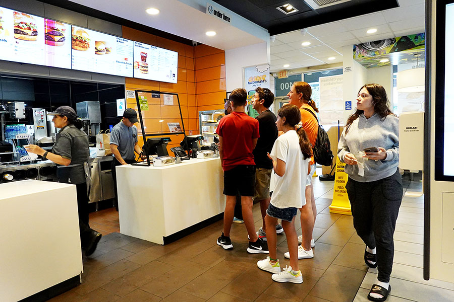 Customers wait to order food at a McDonalds fast food restaurant on July 26, 2022 in Miami, Florida. The McDonald's company reported U.S. same-store sales rose 3.7%, while international sales rose 9.7% during the most recent quarter. However, it also said that total revenue fell 3% to .72 billion; it attributed the weakness to slowing demand in China.
Image: Joe Raedle/Getty Images