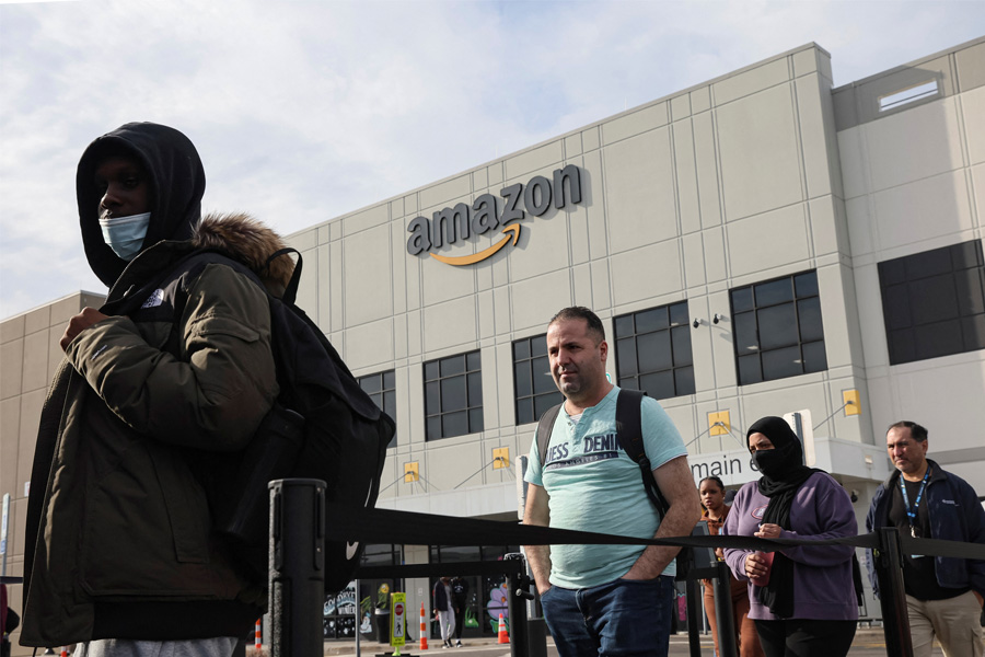 Workers coming out at Amazon's JFK8 distribution center, in the Staten Island borough of New York City, U.S., March 25, 2022.  REUTERS/Brendan McDermid