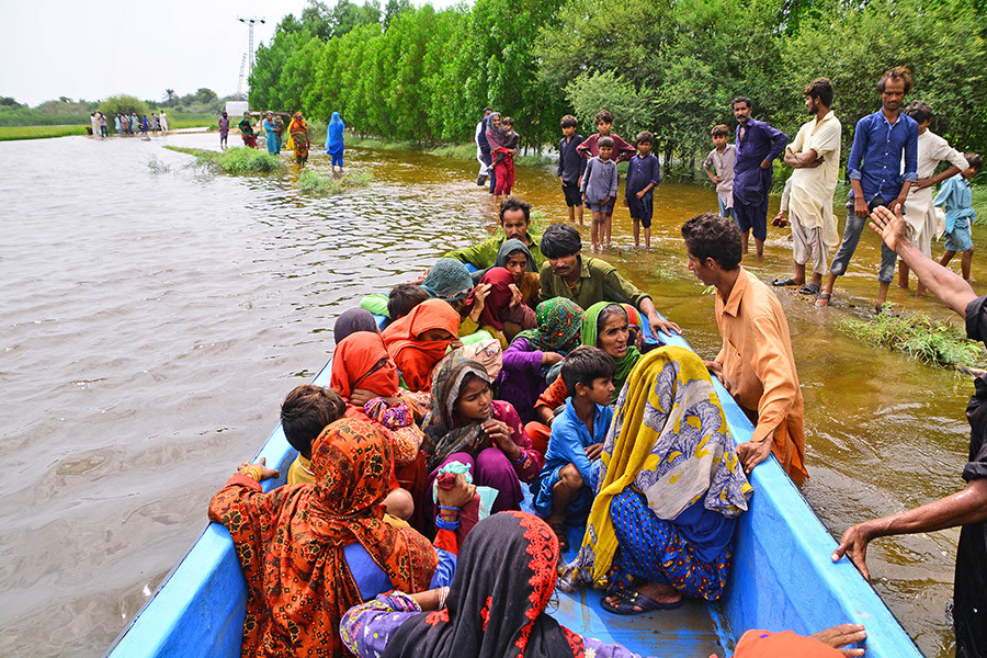 Pakistani flood victims are being move to safer place following flash flood in Tando Muhammad Khan district southern Sindh province Pakistan on august 28, 2022. Pakistan deathtoll from the floods surpassed 1,000 deaths on Sunday.A total of 1,033 peoplePakistan's death toll from the floods surpassed 1,000 deaths on Sunday.A total of 1,033 people died. Image: Shakeel Ahmed/Anadolu Agency via Getty Images

