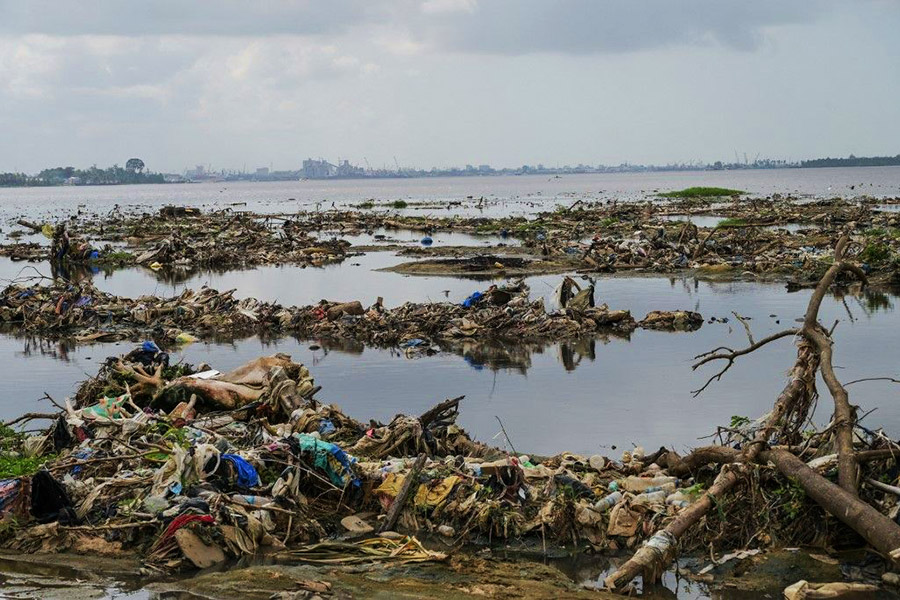 Urban and industrial waste from Yopougon, Abidjan's biggest district, has transformed his village of 3,000 inhabitants into an open dump. Image: Sia KAMBOU / AFP