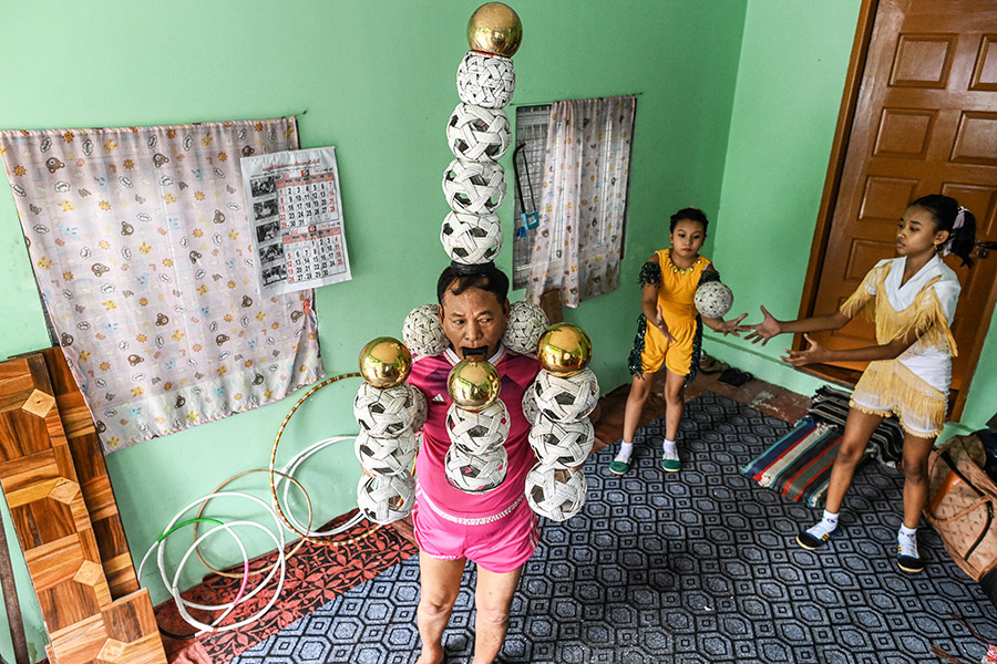 Ohn Myint started practising with Ywal in his 40s, immersing himself in the intense meditation it requires, as a way to restore movement to his limbs after he suffered a stroke. Image: STR / AFP