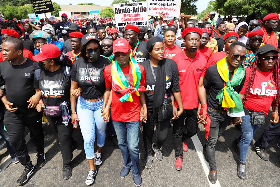 Protesters take part in a march on the second day of a demonstration over soaring living costs in Accra, Ghana, on June 29, 2022. The West African nation, reeling from a pandemic-spurred economic slump and hammered by the impact of Russia's war in Ukraine, has seen inflation surge to more than 27 percent this month -- the highest level in almost two decades.<br>Image: Nipah Dennis / AFP​