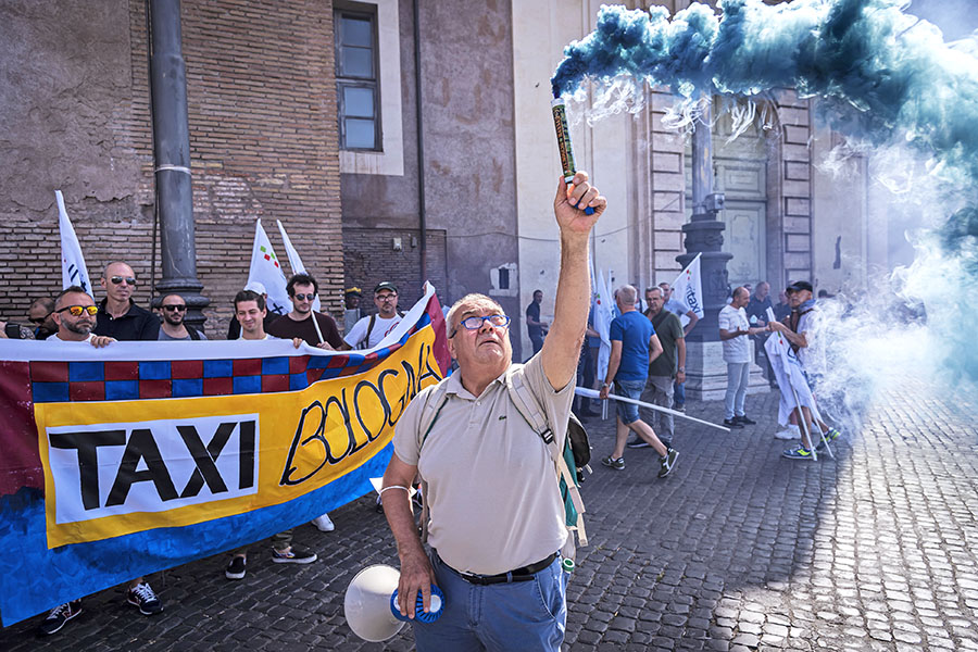 Protesters attend a national demonstration of taxi drivers to demand the withdrawal of Article 10 of the 