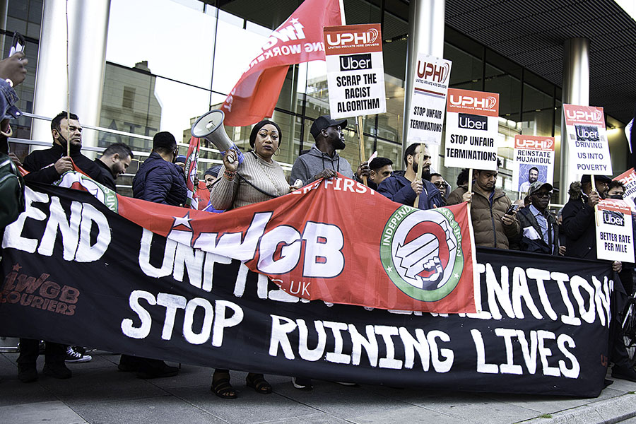 A file photo of Uber drivers' strike, holding a banner and placards at Uber's headquarters in London, October 6, 2021. during the demonstration. Uber drivers demand better rate per mile, 15% max commission, transparency of charges on customers, no fixed rate trips, among other things. Image: Loredana Sangiuliano/SOPA Images/LightRocket via Getty Images