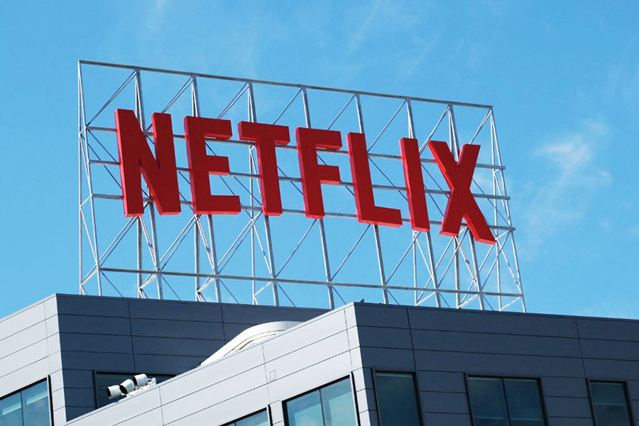 Netflix will work with Microsoft to launch a cheaper subscription plan that includes advertisements. Image: Chris DELMAS / AFP

