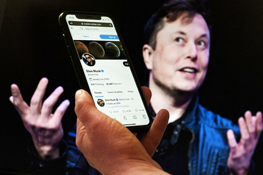 This is an image of Twitter app with Elon Musk in the background. Here's a closer look at the complications around bot accounts, and how they would be key in deciding the case.