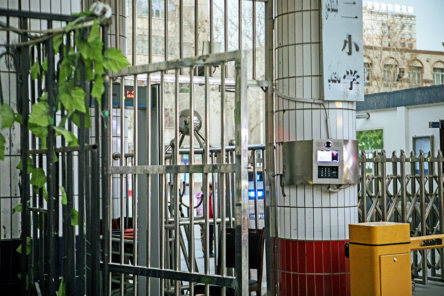 A device for facial recognition at the entrance of a primary school in Hotan, in the western region of Xinjiang, China, on Dec. 11, 2019. As China builds up its vast surveillance and security apparatus, it is running up against growing public unease about the lack of safeguards to prevent the theft or misuse of personal data. (Giulia Marchi/The New York Times) 