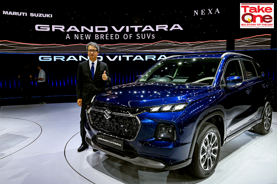 The managing director and chief executive officer of Maruti Suzuki India Limited (MSIL) Hisashi Takeuchi poses with the new  SUV Grand Vitara during its global unveiling ceremony in Gurgaon on July 20, 2022.
Image: Prakash Singh / AFP 