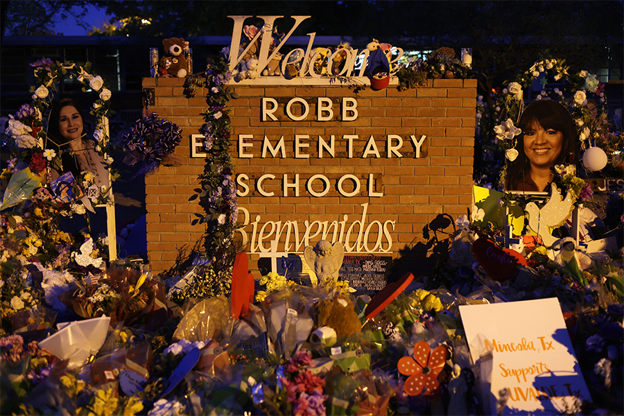 Flowers and photographs are seen at a memorial dedicated to the victims of the mass shooting at Robb Elementary School in Uvalde, Texas. Photo: ALEX WONG/ GETTY IMAGES VIA AFP