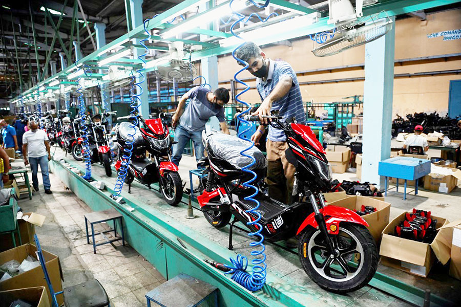 Workers assemble motorcycles at the Angel Villareal Bravo assembly plant, better known as Minerva Cycles, in Santa Clara, in the Cuban province of Villa Clara, on April 26, 2022.