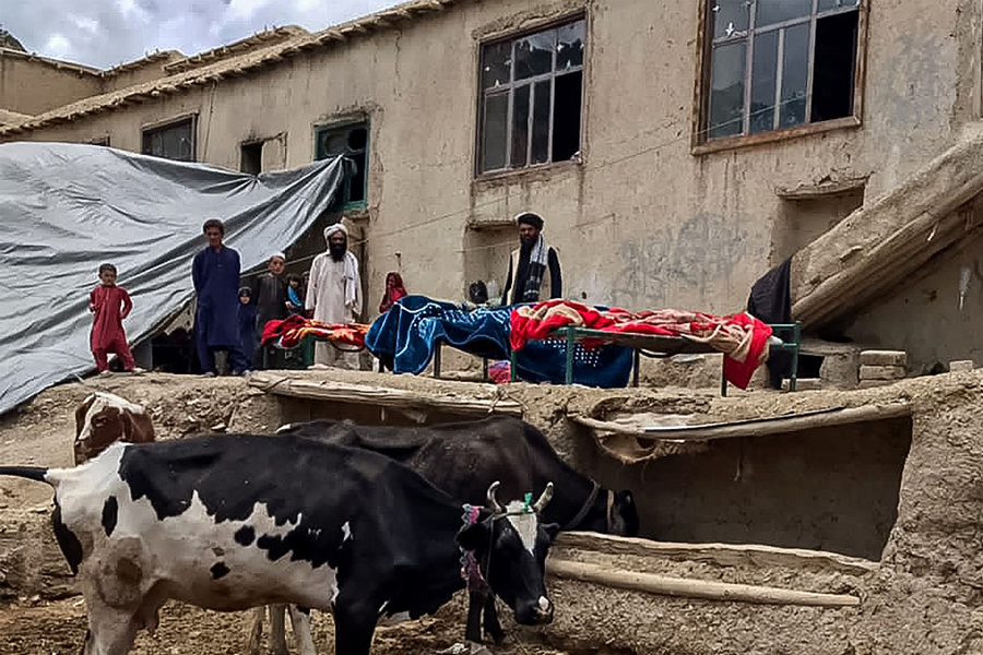 Bodies of Afghan men wrapped in blankets pictured before the burial rituals, who were killed in an earthquake in Gayan district, Paktika province on June 22, 2022. - The 5.9-magnitude quake, which killed at least 1,000 people, struck hardest in the rugged east, where people already lead hardscrabble lives in the grip of a humanitarian crisis made worse since the Taliban takeover in August. (Photo by AFP)