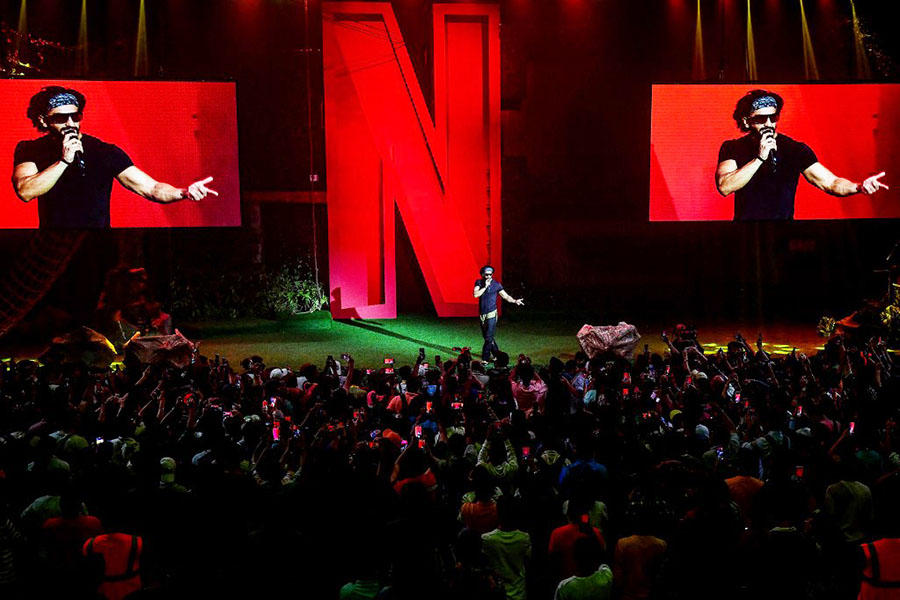 A trailer launch for Bollywood actor Ranveer Singh's upcoming Netflix series ‘Ranveer VS Wild with Bear Grylls’ in Mumbai on June 24, 2022. The streaming platform is planning to introduce a new cheaper subscription model by the end of the year that would break its taboo on advertising. Image: SUJIT JAISWAL / AFP

