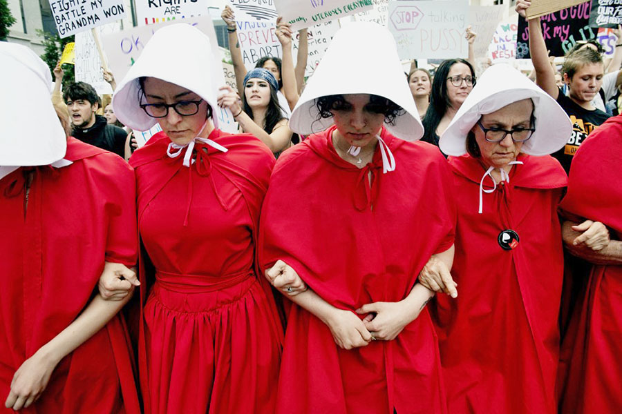 Abortion rights activists, dressed in an outfits from The Handmaid's Tale, lead protestors during a march in Denver, Colorado on June 27, 2022, four days after the US Supreme Court struck down the right to abortion.
Image: Jason Connolly / AFP