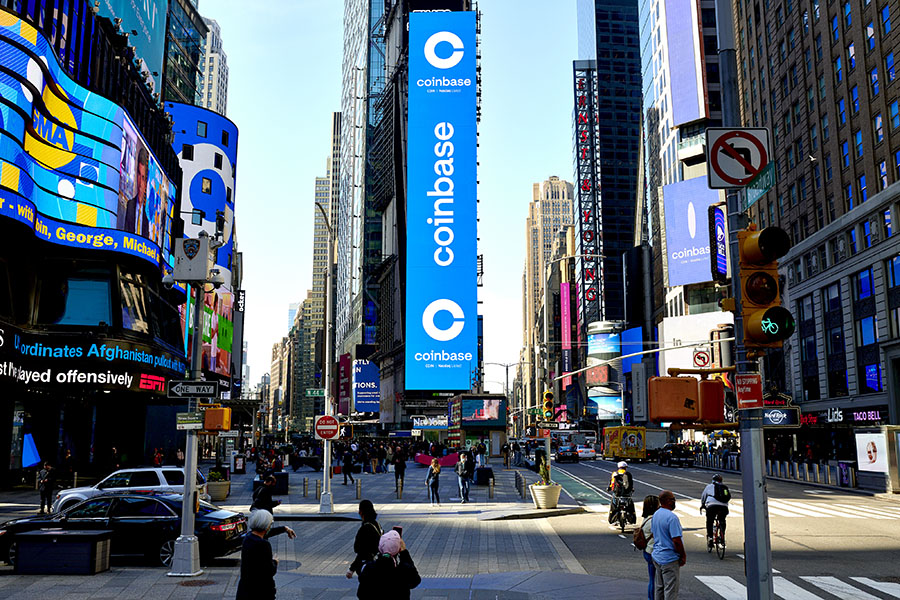 Coinbase’s initial public offering is displayed on the Nasdaq Tower in Times Square in New York, on April 14, 2021. No cryptocurrency investor has been spared the pain of plunging prices; however, the fallout from more than 0 billion in losses is far from even. (Gabby Jones/The New York Times).
