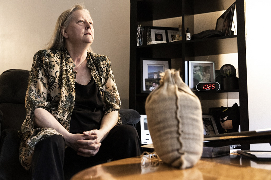 Cindy Armstrong is pictured with a bag containing the composted remains of her son Andrew Armstrong at her home in Covington, Washington on March 15, 2022. Armstrong recalled her son Andrew insisting on the so-called 