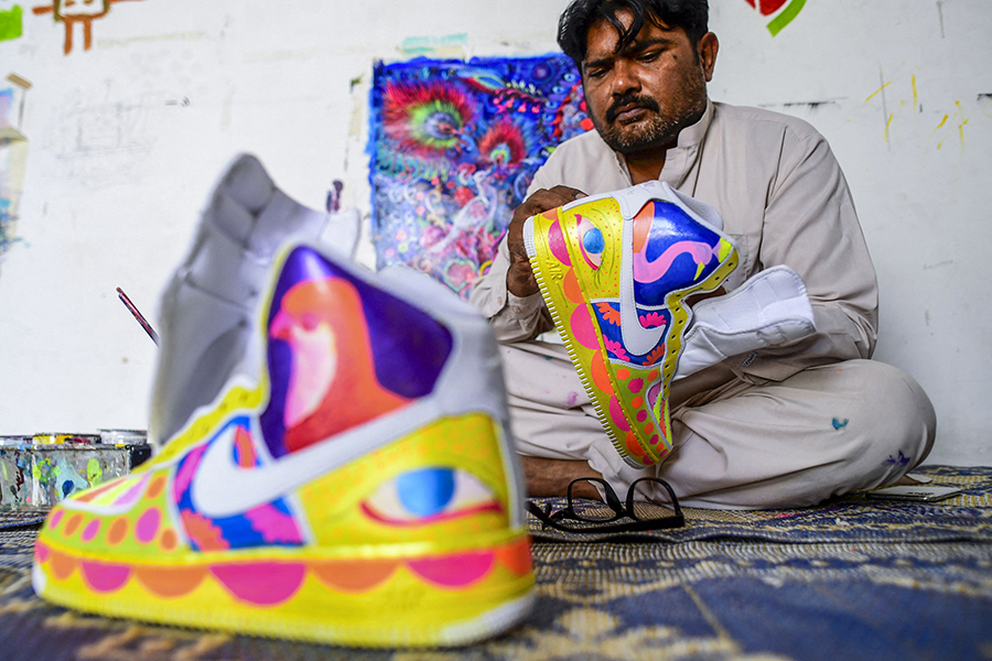 
Haider Ali has transposed Pakistan's renowned 'truck art' onto sneakers
Image: Asif Hassan / AFP