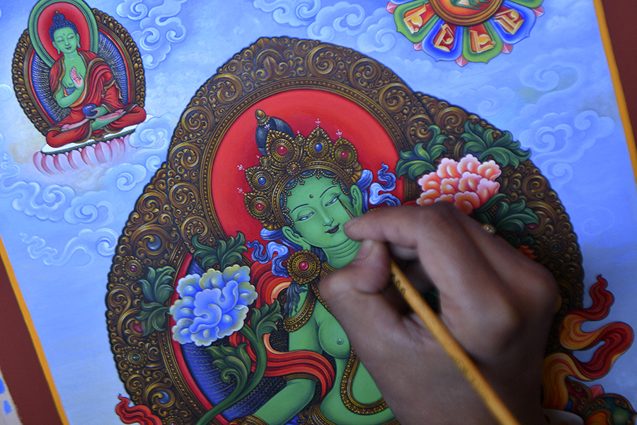 Paubha artist Ujay Bajracharya works on his rendition of the Green Tara, a goddess of compassion revered by Buddhists and Hindus in the country, in Lalitpur on the outskirts of Kathmandu.
Image: Prakash Mathena/ AFP