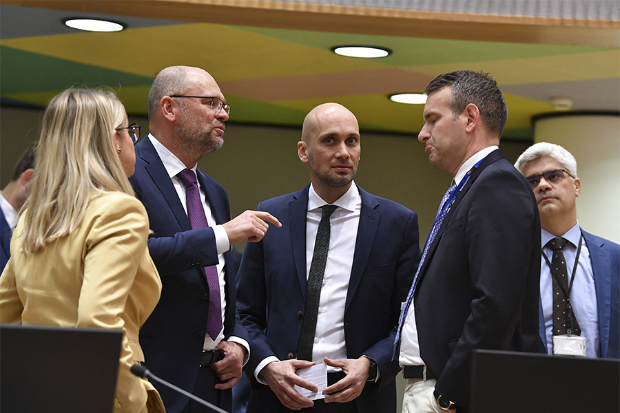 Slovakia Minister of Economy Richard Sulik (L) talks with Hungary State Secretary for Development of Circular Economy and for Energy and Climate Policy, the ministry of Innovation and Technology Attila Steiner (R) during the Special European Energy Ministers Council on Russian gas and petrol crisis at the EU headquarters in Brussels on May 2, 2022.​ (Credit: JOHN THYS / AFP)