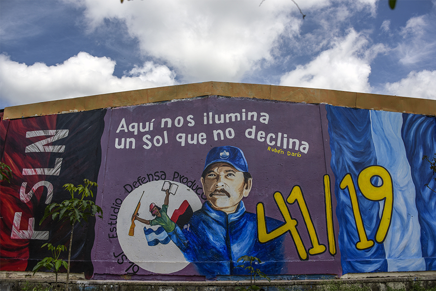 A mural depicting president Daniel Ortega in Estelí, Nicaragua, on July 2, 2021. The slogan at top is a quotation from the 19th century Nicaraguan poet Rubén Dario and reads “Here we are illuminated by a sun that does not decline.” (Inti Ocon/The New York Times)