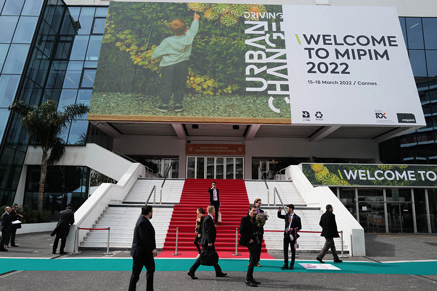 People visit the MIPIM international real estate show for professionals at the Palais des Festivals in Cannes, southeastern France on March 15, 2022. Image: Valery Hache/AFP