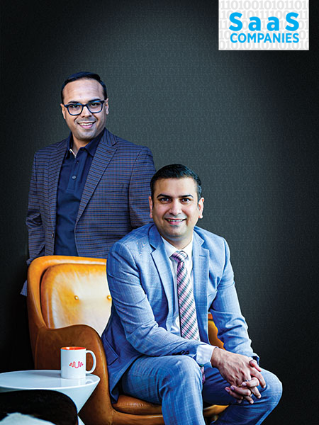 Umesh Sachdev (standing), co-founder & CEO; Ravi Saraogi, co-founder & president APAC, Uniphore Solutions