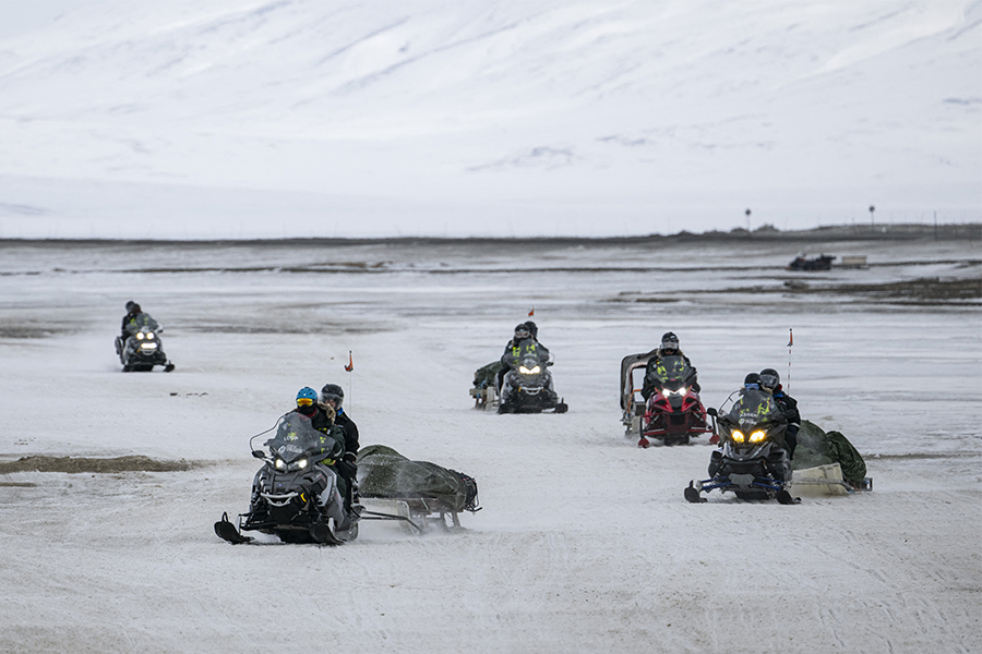 Tourists come back to Longyearbyen after a tour on snow mobiles, on May 8, 2022, on Spitsbergen island, in Svalbard Archipelago, northern Norway.​ Image: Jonathan NACKSTRAND / AFP