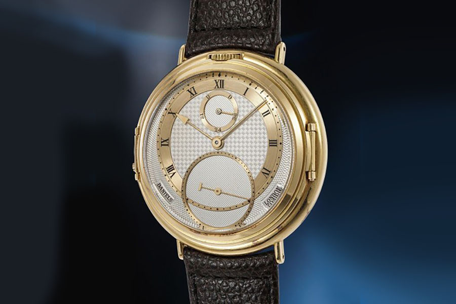 George Daniels ; A unique, historically important double sided yellow gold wristwatch with power reserve, day and date
Image: Courtesy of Phillips Auctions 