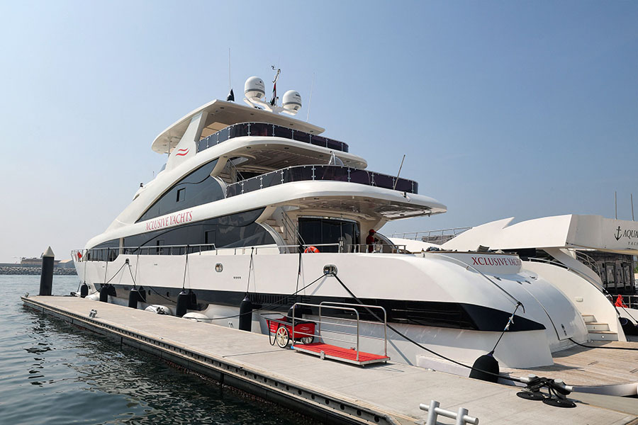 The boat, which can accommodate up to 125 people, is among a number of pristine white yachts at Dubai's Marina Harbour