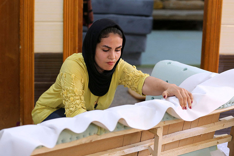 	Iraqi carpenter Nour al-Janabi works at her home furniture workshop in Baghdad's Abu Dsheer area. Image: Photography Sabah ARAR / AFP