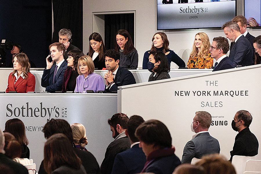 Sotheby’s staff take calls for offsite bids during “The Now Evening Auction” in New York
Image: Yuki Iwamura / AFP