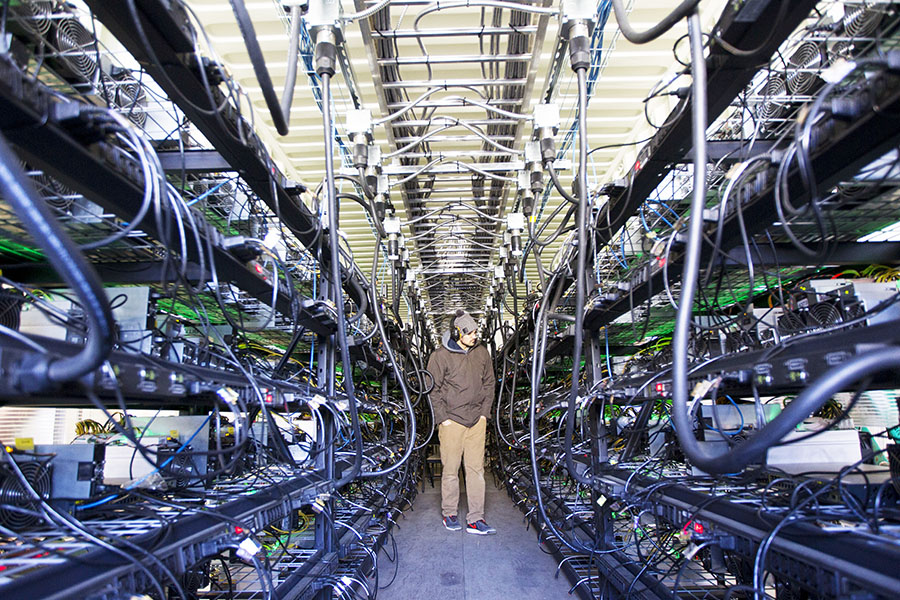 The business model of crypto miners who used vast power-guzzling computer rigs to compete with each other to solve complex equations, and win the prize of adding entries to the blockchain and generate coins was wiped out overnight by the Ethereum software upgrade called the 'Merge'. Image: Natalie Behring/Getty Images

