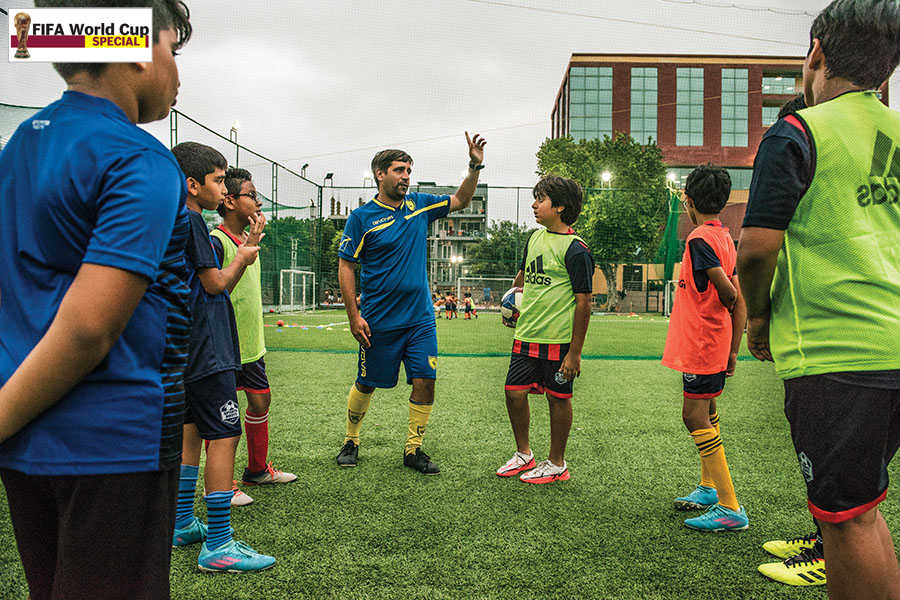 Davide Marchini (in blue jersey), a Uefa B licensed coach from Italy and technical director of Sports Roots, holds a session in Gurugram
Image: Amit Verma