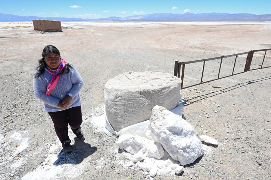 Veronica Chavez, president of the indigenous Kolla Santuario de Tres Pozos community in the northern province of Jujuy, Argentina at the Salinas Grandes salt flat, on October 18, 2022. The turquoise glimmer of open-air pools meets the dazzling white of a seemingly endless salt desert where hope and disillusionment collide in Latin America's 