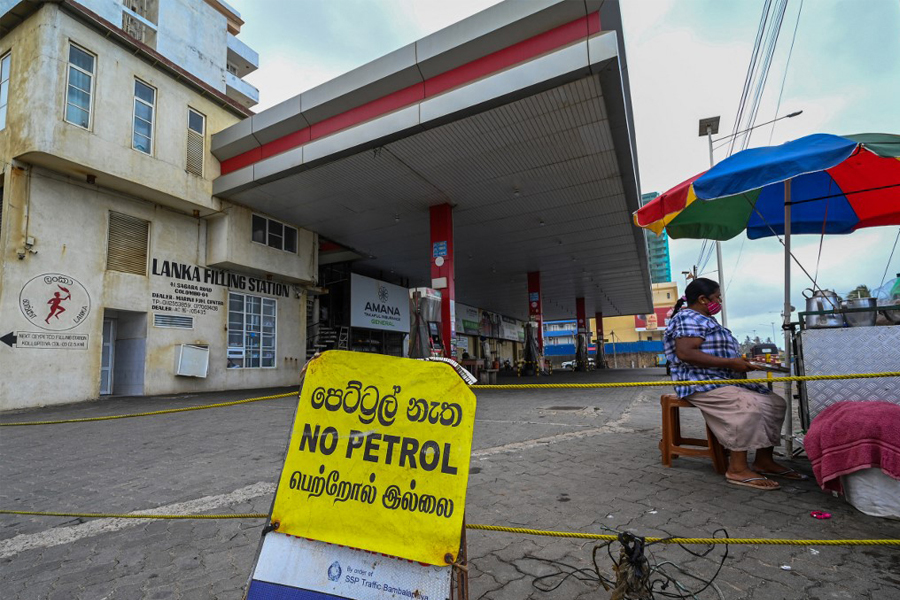 A sign reading 'No Petrol' is seen at a closed Ceylon Petroleum Corporation fuel station in Colombo August 26, 2022. The International Monetary Fund said Thursday it had reached a staff-level agreement to support bankrupt Sri Lanka with a .9 billion bailout spread over four years. ​Image: Ishara S. Kodikara / AFP

