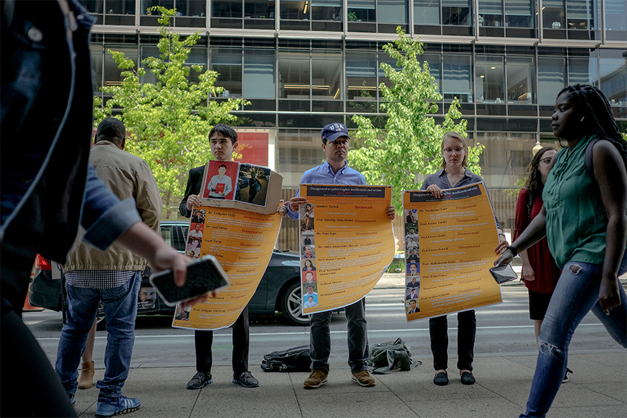 FILE — Uyghur supporters hold a rally encouraging sanctions against Chinese officials in Washington on Friday, May 3, 2019. For the many Uyghur activists who have campaigned — often at great personal cost — to bring China’s intense crackdown in Xinjiang to light, the United Nations report released on Aug. 31, 2022 that largely validated their claims was a powerful, if long-delayed, vindication. Image: Gabriella Demczuk/The New York Times