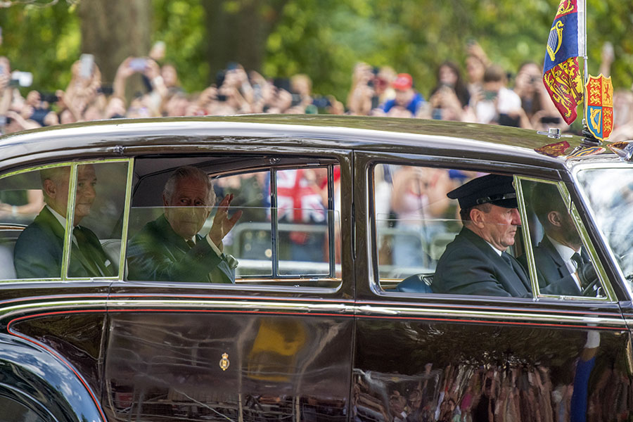 King Charles III waves as he is driven to Buckingham Palace in London on Sunday, Sept. 11, 2022. Charles spent years turning his royal estate into a billion-dollar portfolio. (James Hill/The New York Times)