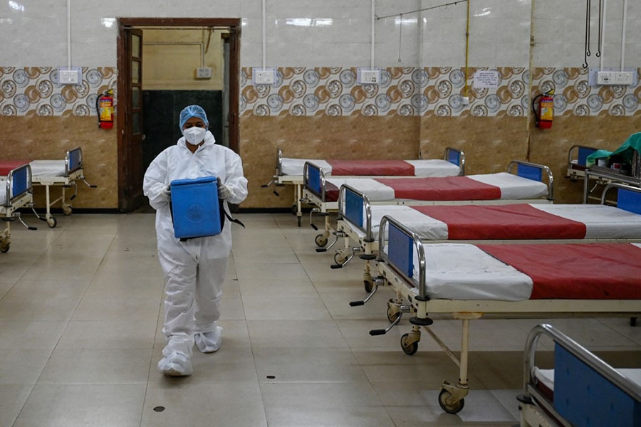 A healthcare worker collects a swab sample of a woman for Covid-19 test, amid a rise in coronavirus cases in India, in New Delhi on April 17, 2023. Image: Arrush Chopra/NurPhoto via Getty Images