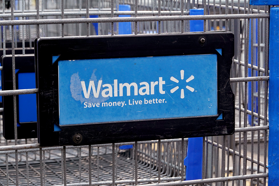 (File photo)The company logo is shown on the front of a shopping cart at a Walmart store on May 18, 2023, in Chicago, Illinois. Image: Scott Olson/Getty Images via AFP